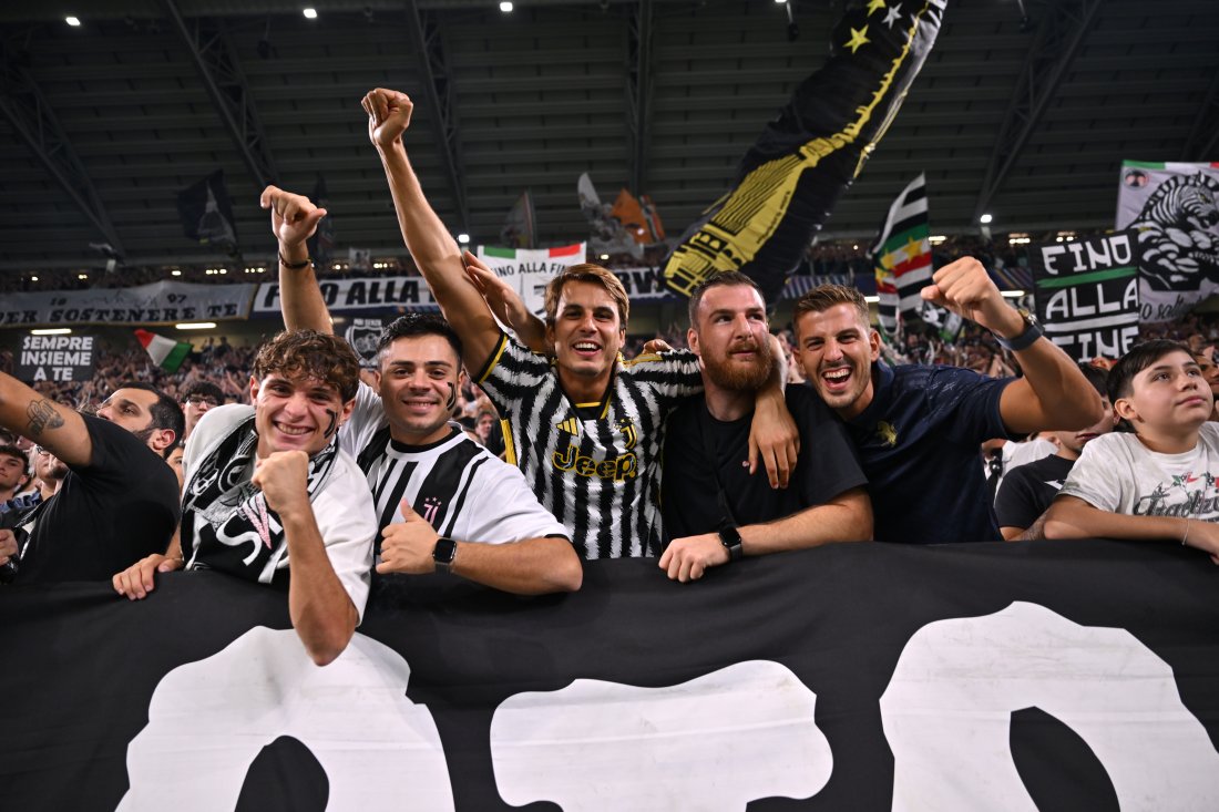 TURIN, ITALY - SEPTEMBER 16: Fans of Juventus pose for a photo as they show their support during the UEFA Champions League 2025/26 League Phase MD1 match between Juventus and Borussia Dortmund at Juventus Stadium on September 16, 2025 in Turin, Italy. (Photo by Tullio Puglia - UEFA/UEFA via Getty Images)