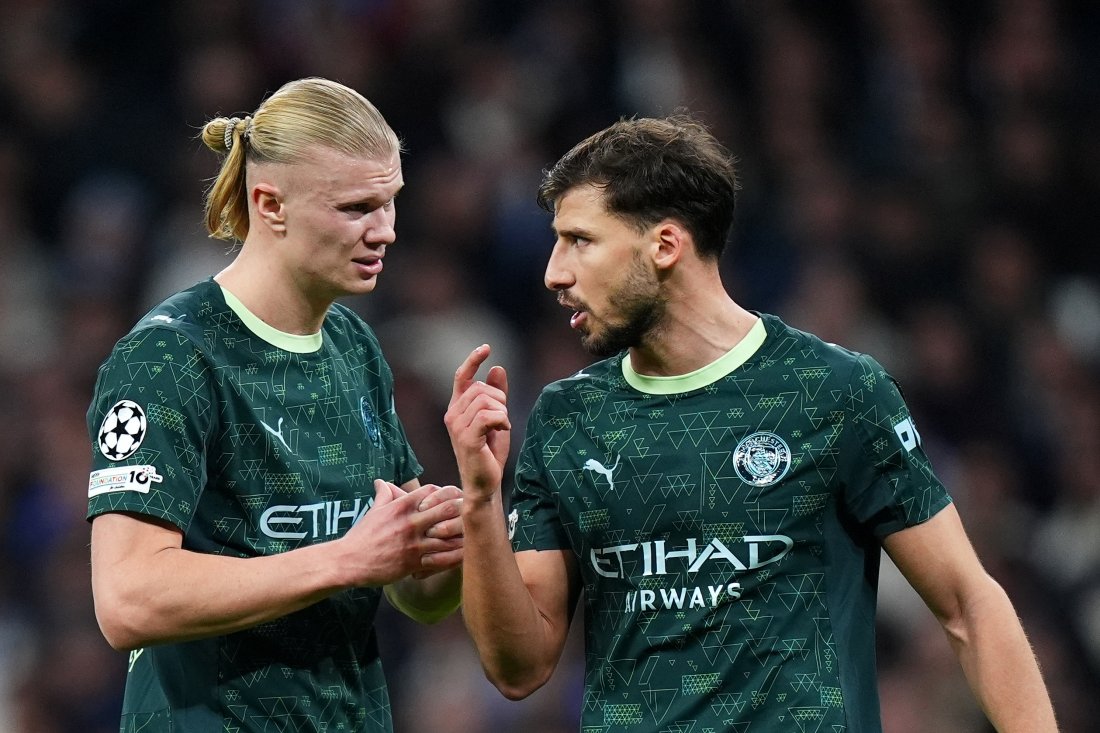 MADRID, SPAIN - DECEMBER 10: Erling Haaland of Manchester City talks with teammate Ruben Dias during the UEFA Champions League 2025/26 League Phase MD6 match between Real Madrid C.F. and Manchester City at Estadio Santiago Bernabeu on December 10, 2025 in Madrid, Spain. (Photo by Angel Martinez - UEFA/UEFA via Getty Images)