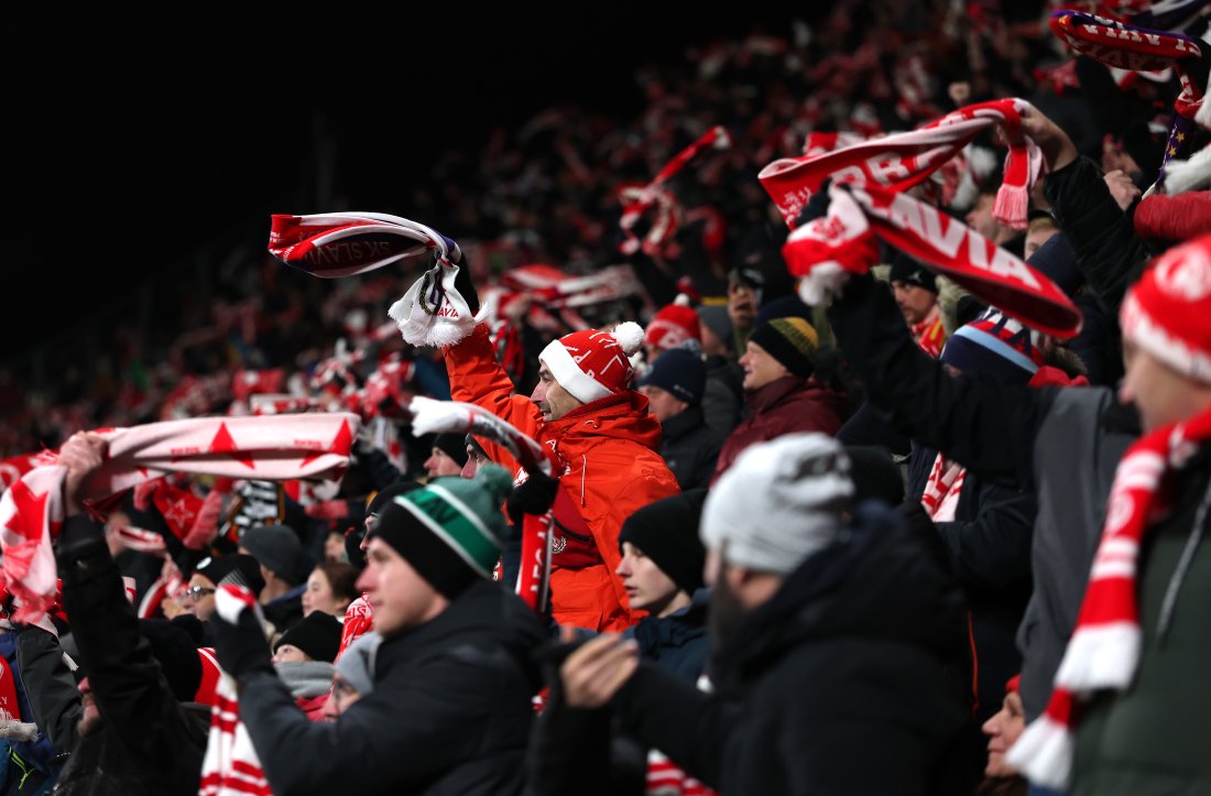 PRAGUE, CZECH REPUBLIC - DECEMBER 12: Fans of Slavia Praha celebrate a goal during the UEFA Europa League 2024/25 League Phase MD6 match between SK Slavia Praha and RSC Anderlecht at Eden Arena on December 12, 2024 in Prague, Czech Republic. (Photo by Alex Pantling - UEFA/UEFA via Getty Images)